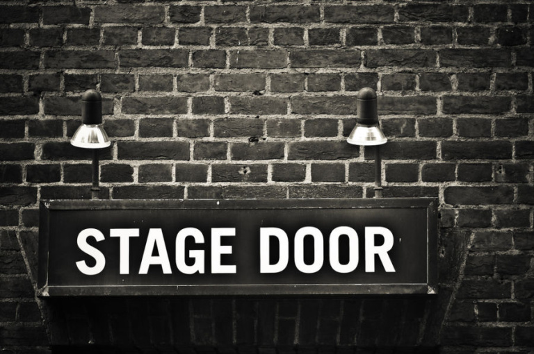 Out the door. Stage Door.